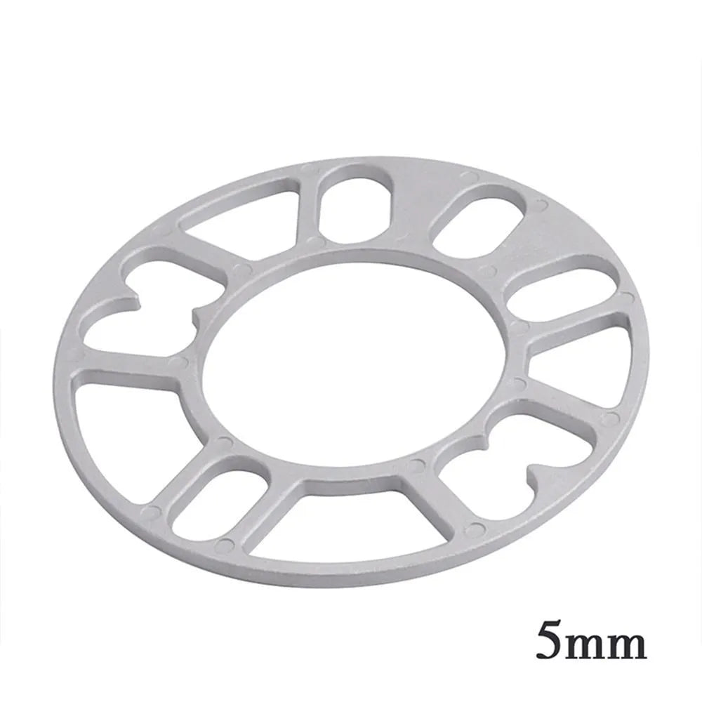 Automotive wheel hub widening spacer ET gasket in various thicknesses for brake caliper clearance.