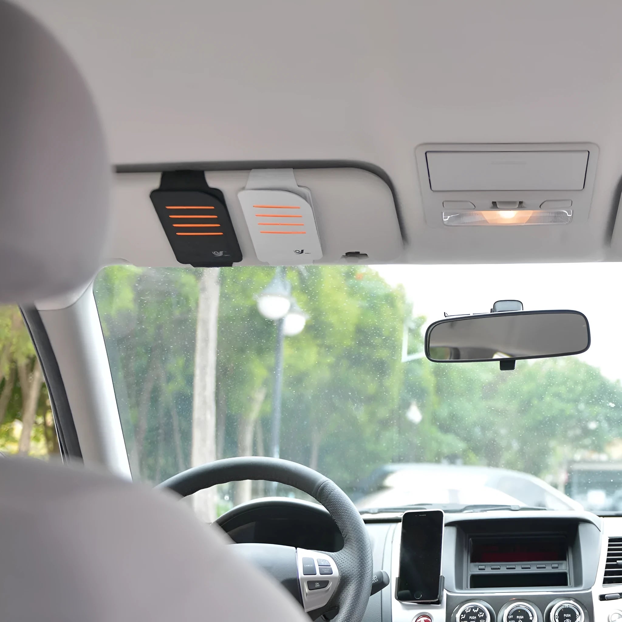 Car sun visor set showing four shading panels and vehicle-mounted storage bag