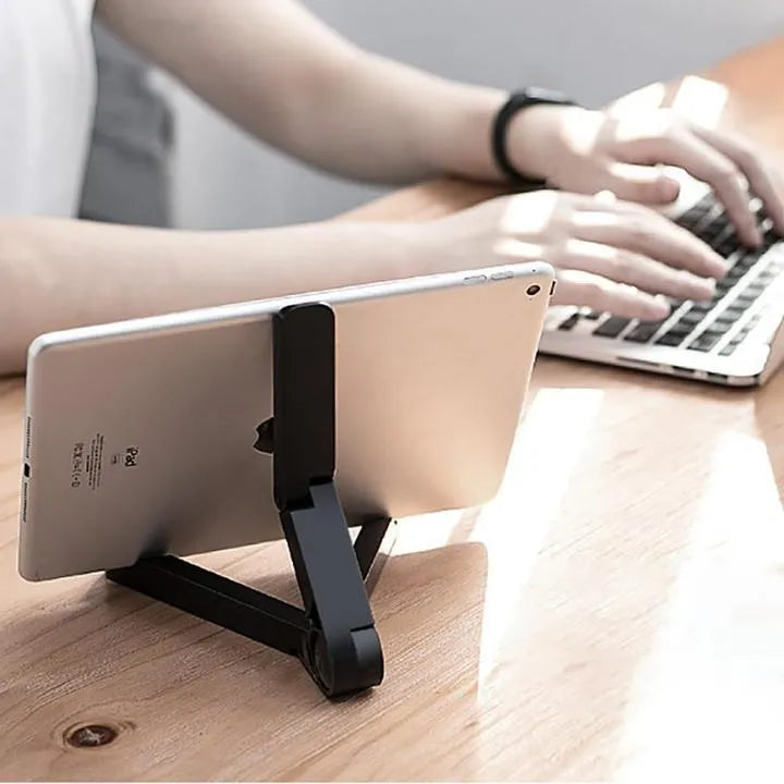 Black foldable aluminium tablet holder showing adjustable angles and flat-folded profile