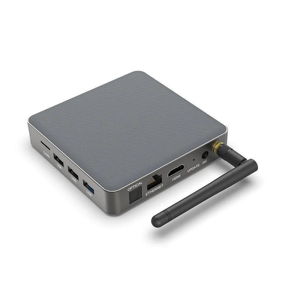 Black Android set-top box with HDMI port, measuring 105x105x20mm, beside its remote control and power adapter.