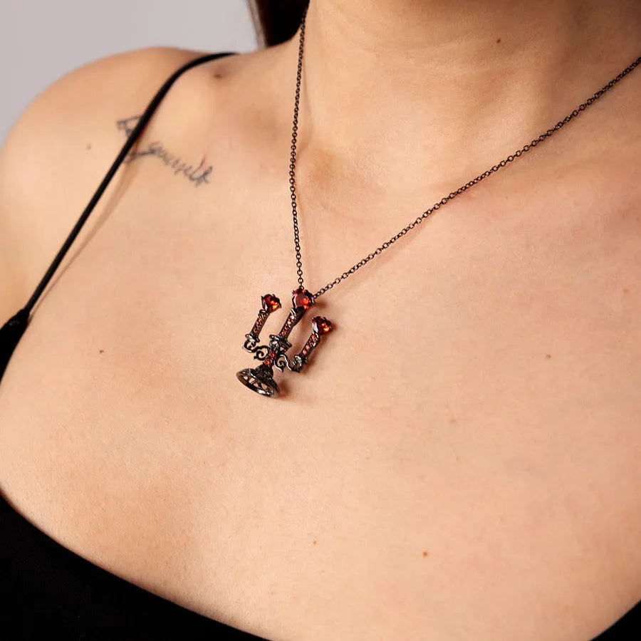 Gothic style zinc alloy clavicle chain necklace with a hollow candlestick pendant in a retro colour finish.