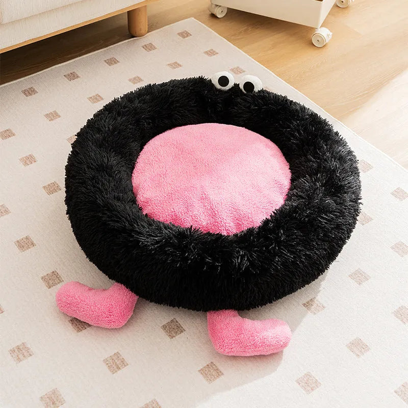 Elf Briquettes blue plush pet bed mat inside a dog crate