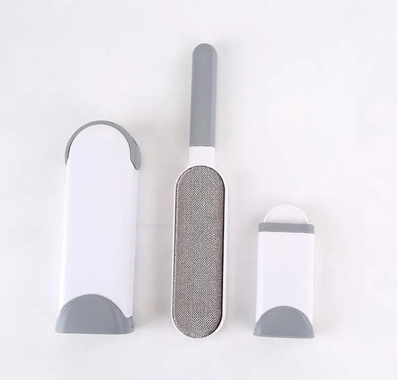 Blue reusable pet hair brush with self-cleaning base for sofas and furniture.