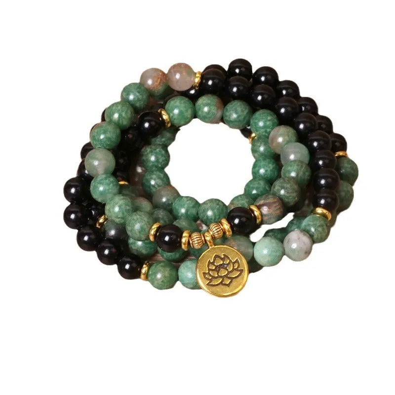Green and black alloy elastic beaded long bracelet showing stretch design and personality-themed elements