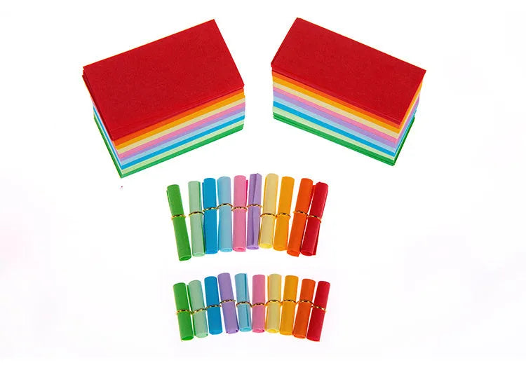 Colourful drift bottle message paper scrolls in various sizes with metal eyelets for hanging.