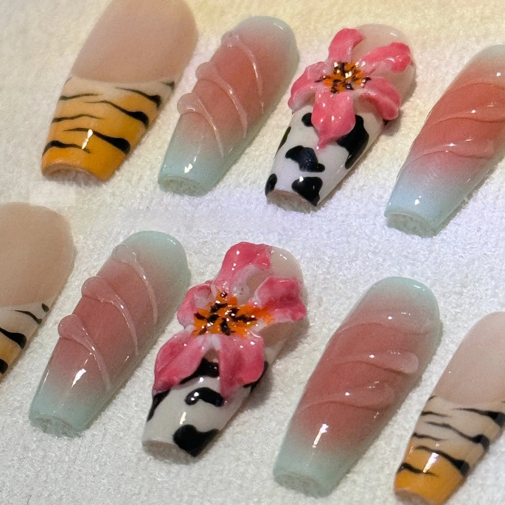 Zebra pattern Lily hand carving nail art with embossed flower designs in four sizes
