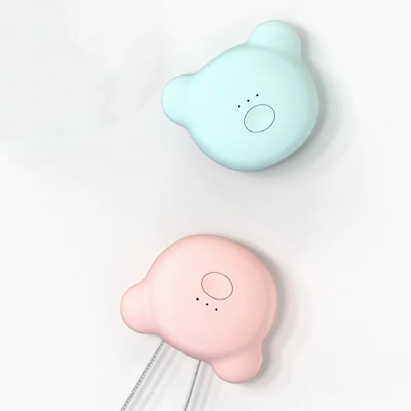 Mini USB air purifier necklace in pink, showing compact dimensions and wearable design.