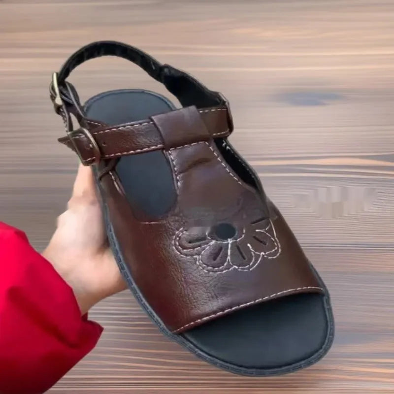 Men's black embroidered beach sandals with floral pattern and flat heel design