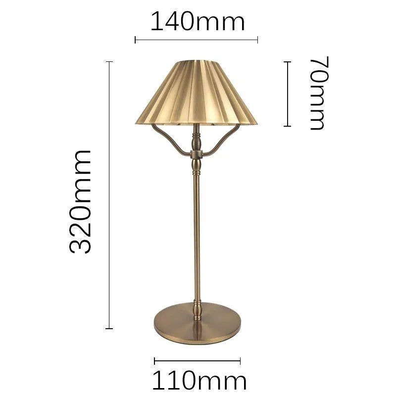 Gold-coloured alloy desk lamp with USB charging port and touch-sensitive control.