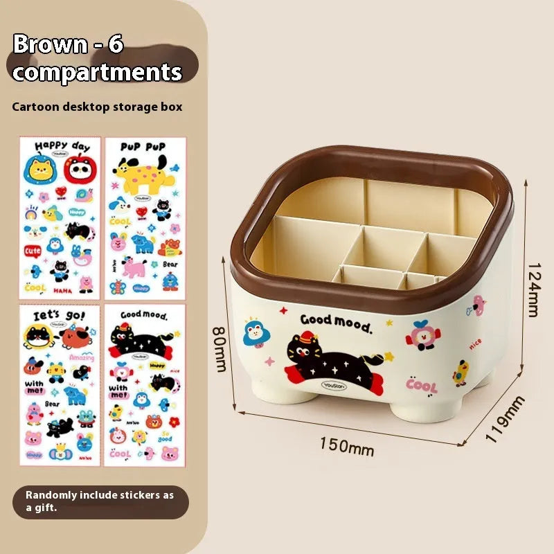 Cartoon-style plastic desktop organiser with grid compartments and labelling stickers for stationery storage
