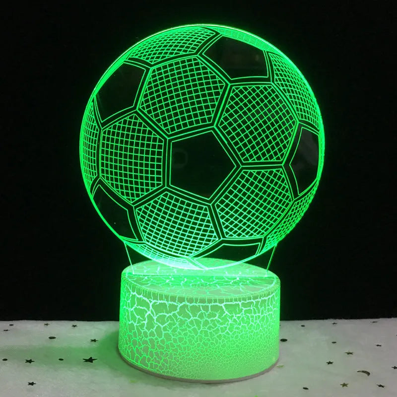 3D football-shaped acrylic night light displaying blue LED colour on a black ABS base.