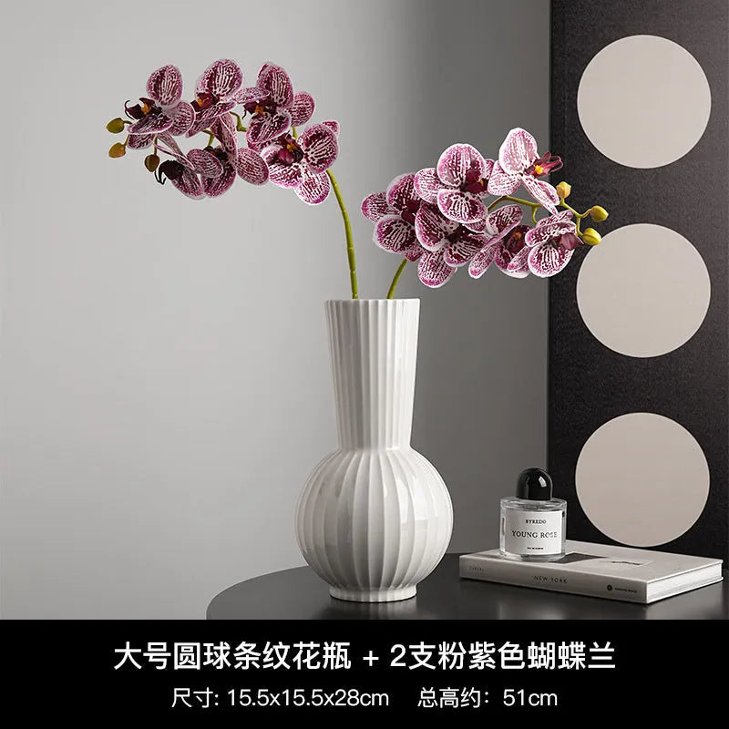 White ceramic ball striped vase in American country style on table with orchid arrangement