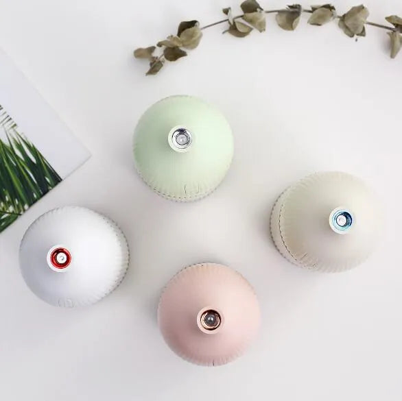 White USB-powered 300ml aromatherapy diffuser with LED light showing compact dimensions