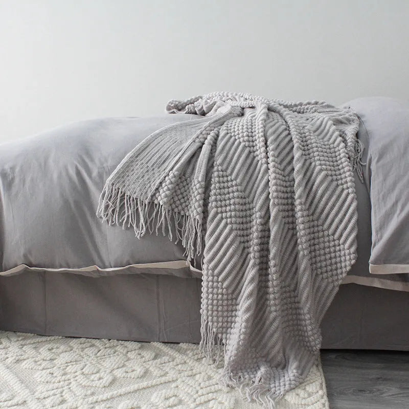 Small rectangular polyester nap blanket in dark grey, khaki, or light grey, shown flat with dimensions 127cm by 170cm.