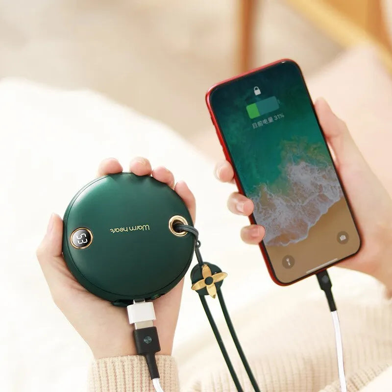 Green hand warmer power bank showing digital display with 5000mAh capacity