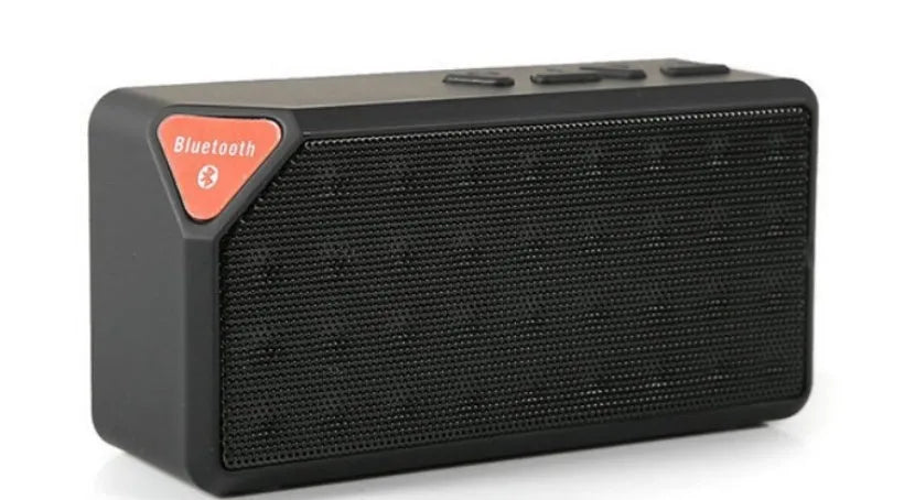 Cannon X3 mini cube-shaped wireless Bluetooth speaker in one of five colours: black, blue, green, red, or yellow.