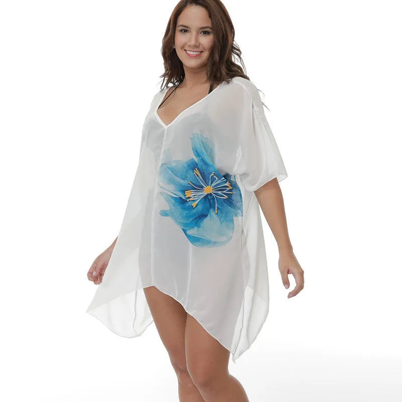 A white, loose-fitting plus size beach cover-up blouse for swimming and sun protection.
