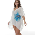 A white, loose-fitting plus size beach cover-up blouse for swimming and sun protection.