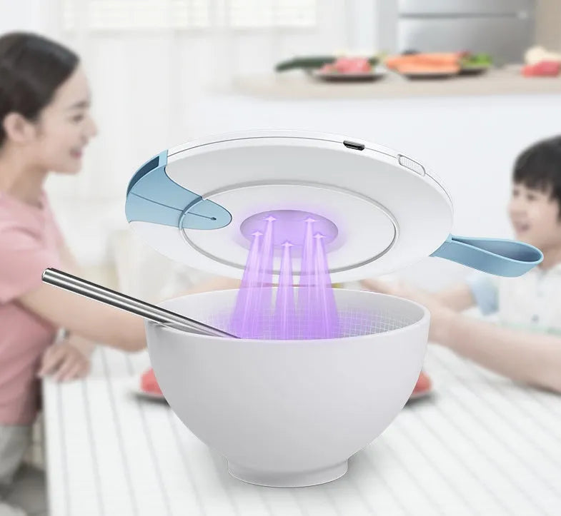 A slim, portable UV baby bottle steriliser in blue, showing its compact size and USB charging port.
