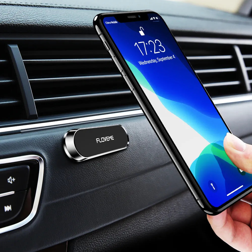 Black magnetic car phone holder with adhesive base showing square silver iron plate and foam glue backing