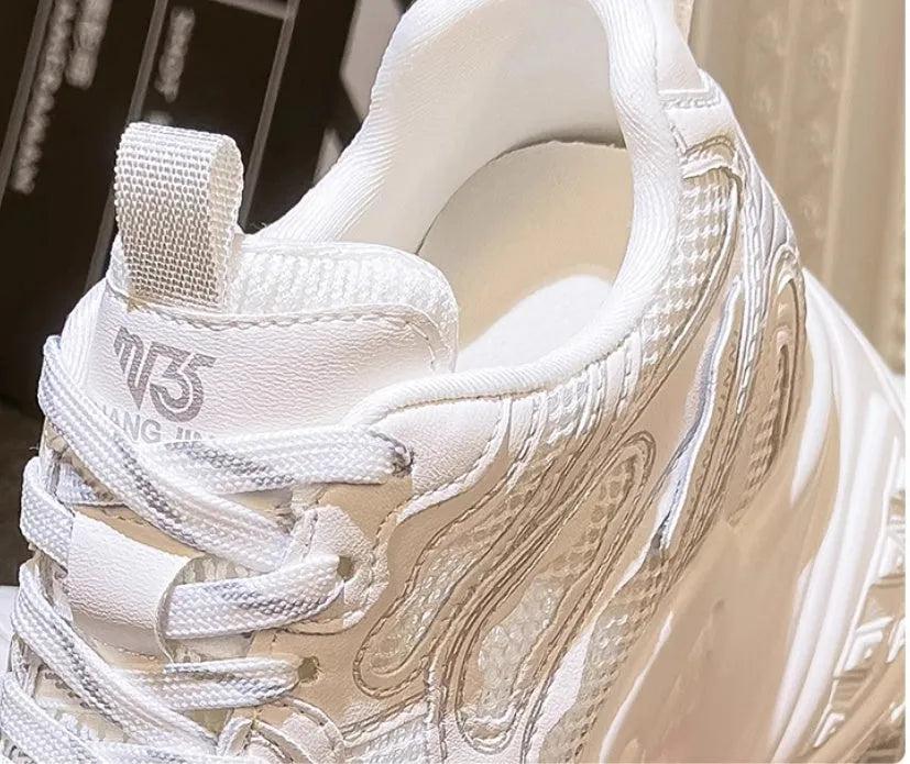 White women's height increasing dad shoes with lace-up front and round toe.