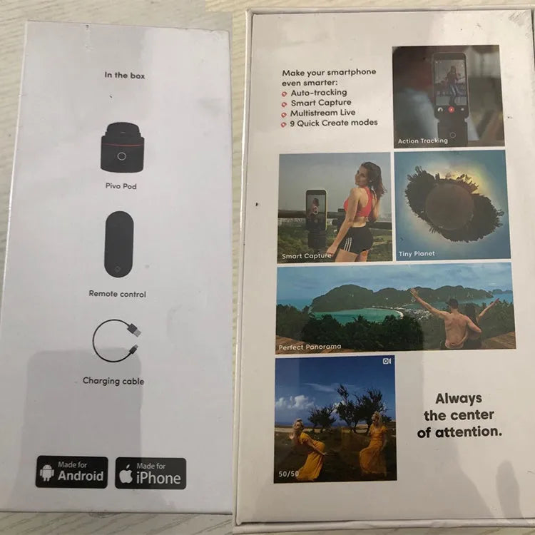 Matte black PIVO facial tracking camera rotating a smartphone on a table.
