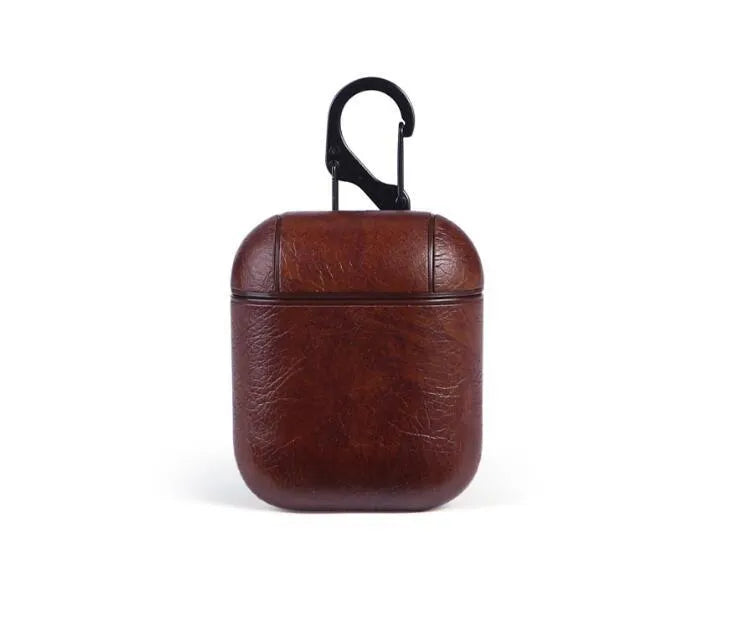 Genuine leather protective case sleeve for Apple Airpods charging case in black, brown, light brown, and red.