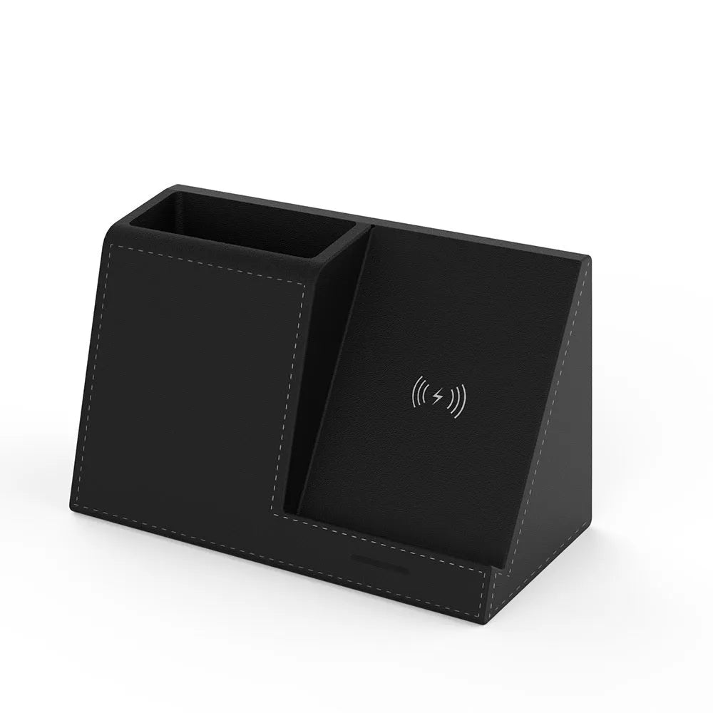 Black leather desk organiser with wireless phone charging pad and pen holder slots.