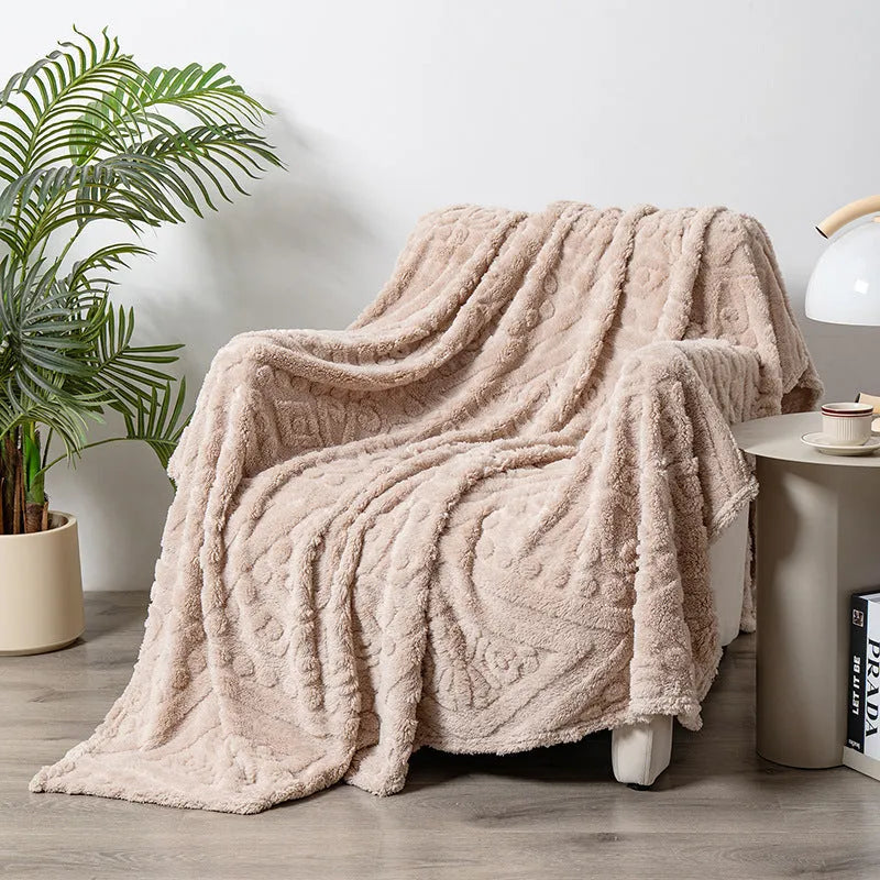 Polyester velvet jacquard blanket in fog blue colour showing texture and size on modern sofa