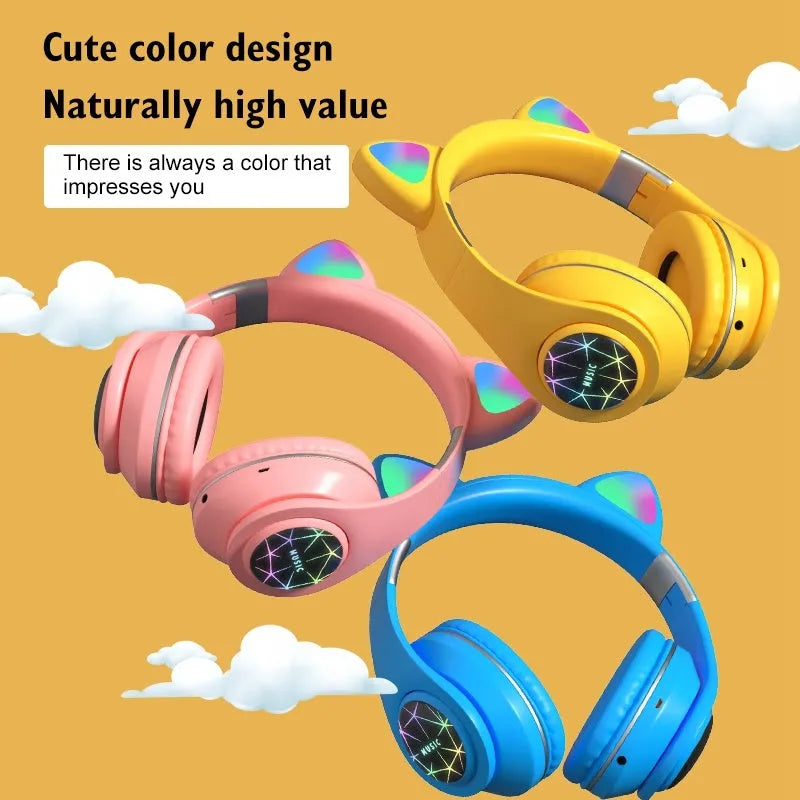 Colourful cat ear style wireless Bluetooth sports headset with a headband, shown in pink.