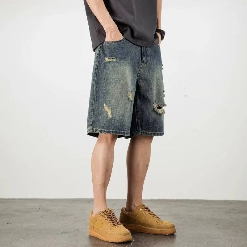 Blue men's denim shorts with a retro loose hole distressed design and a straight-leg cut