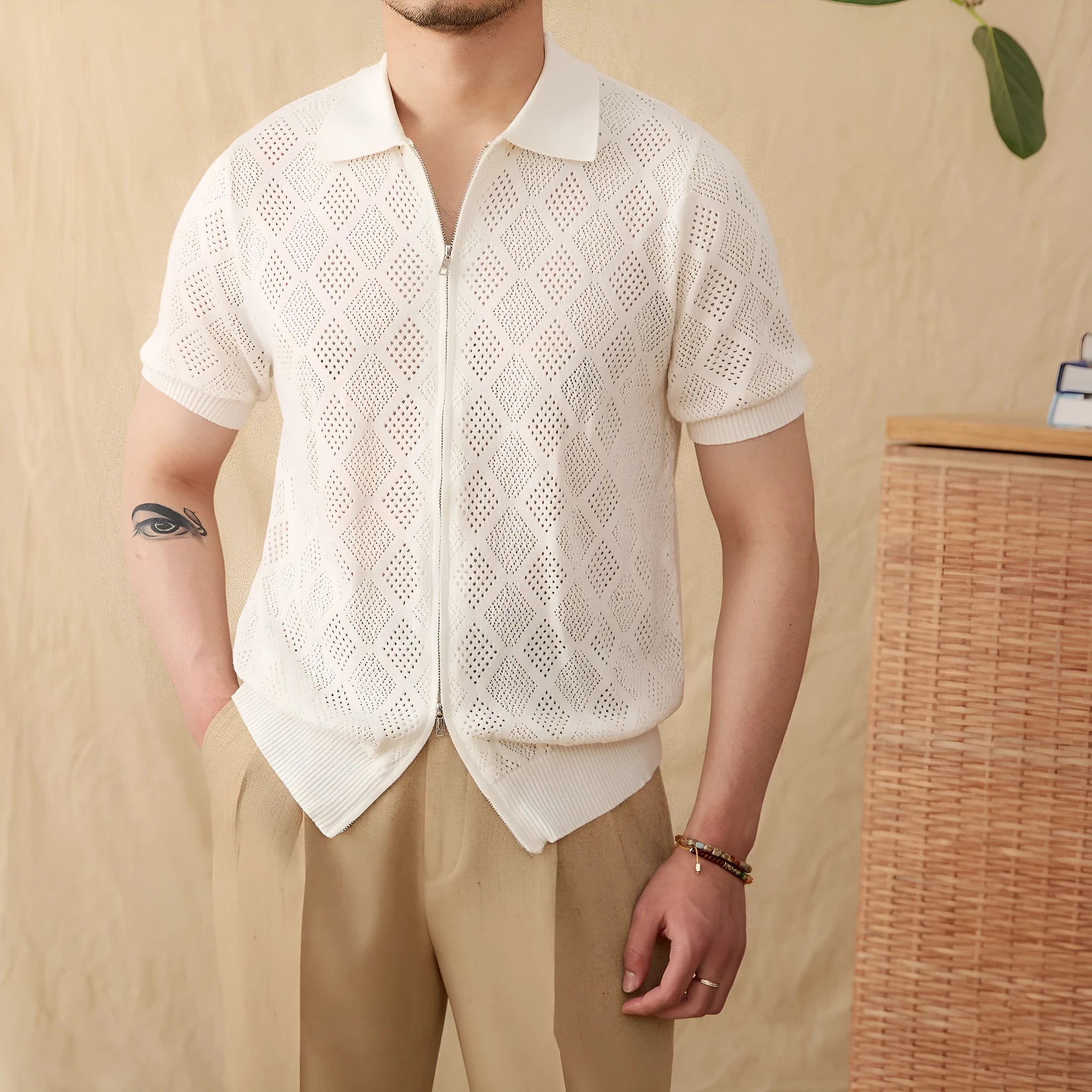Light brown zip-front cotton cardigan with a lapel collar and short sleeves.
