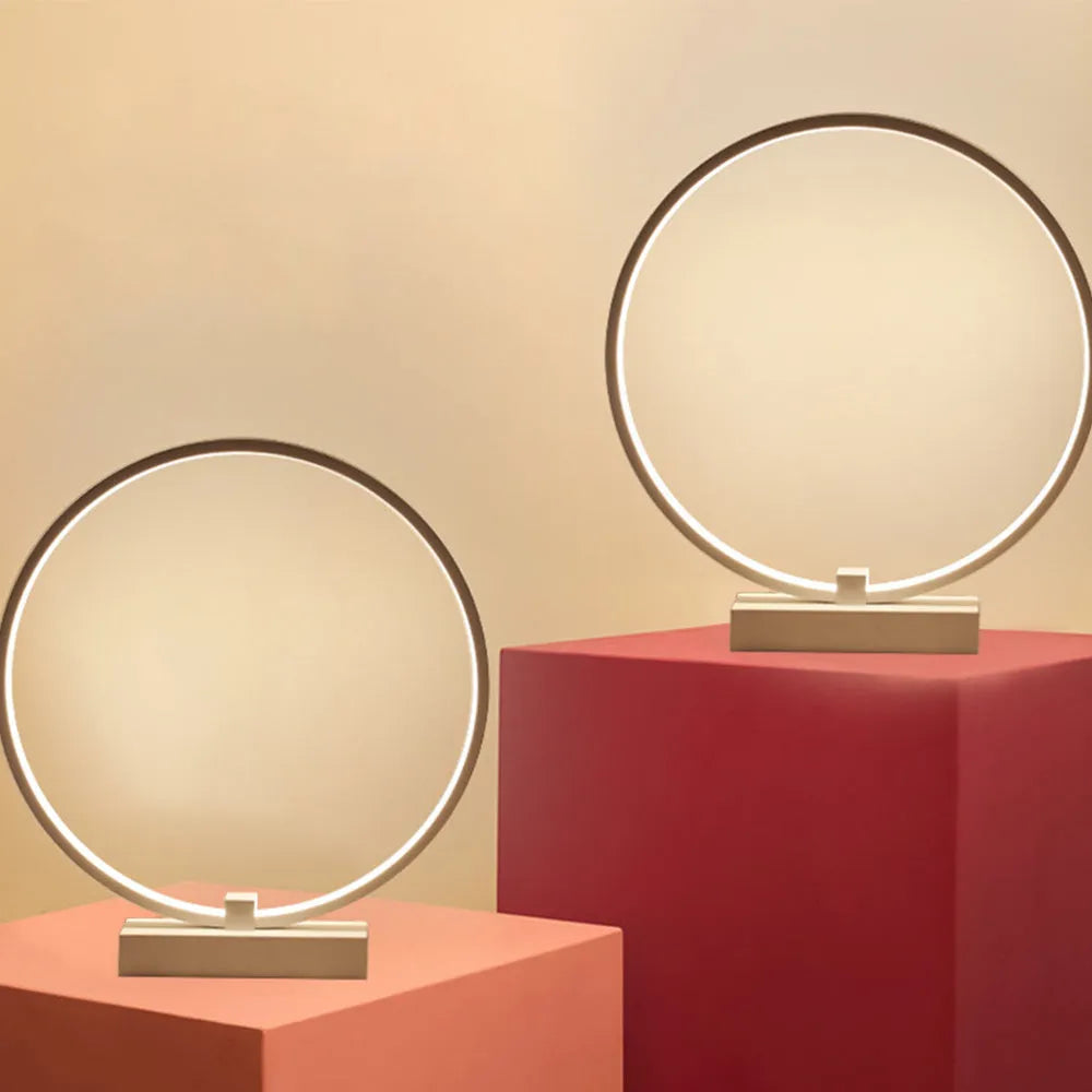 25cm round white LED bedside lamp with acrylic frame and iron base, shown in warm white or cool white
