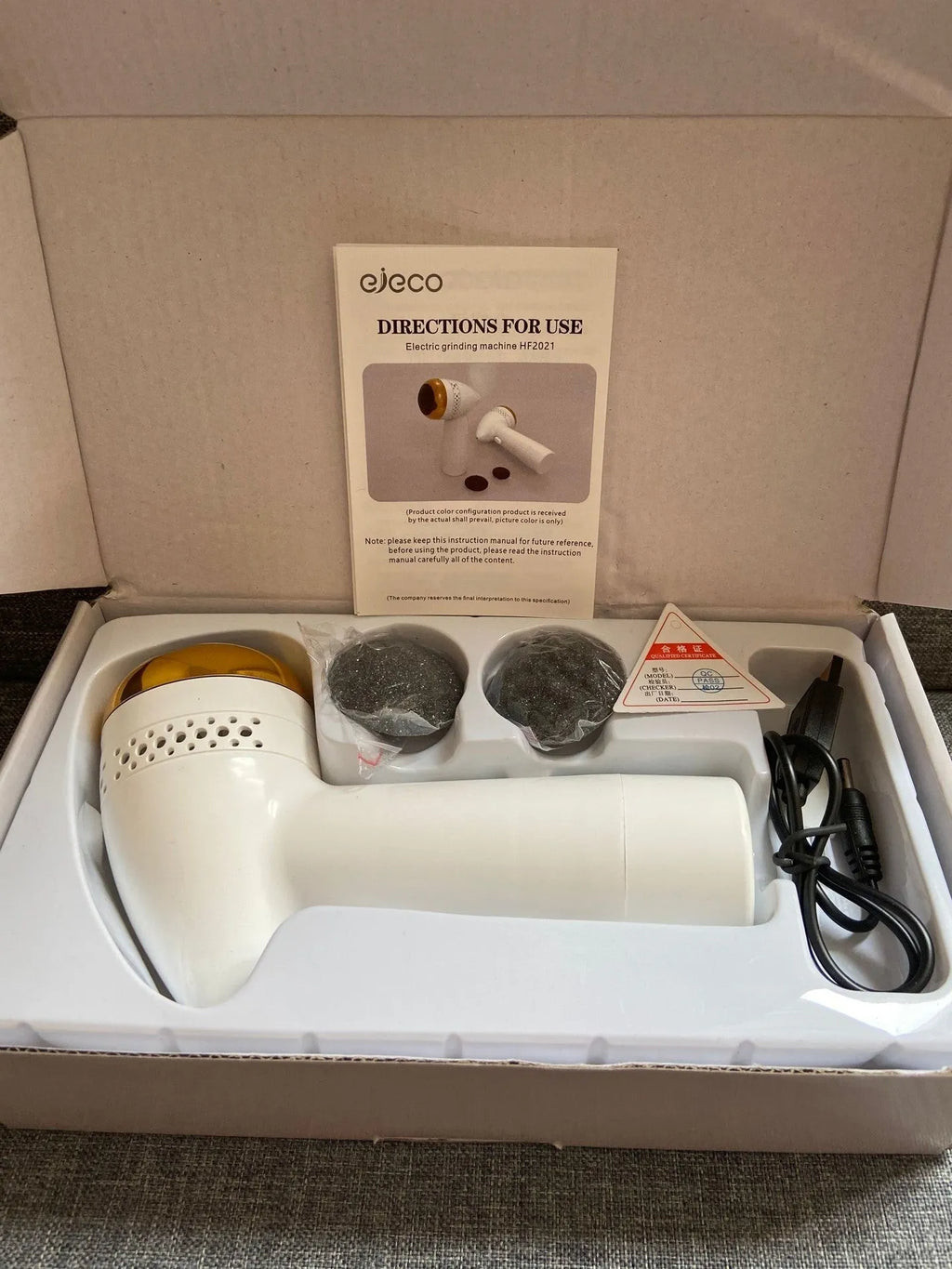 Electric vacuum foot grinder in metallic gold finish with a refined quartz grinding head.