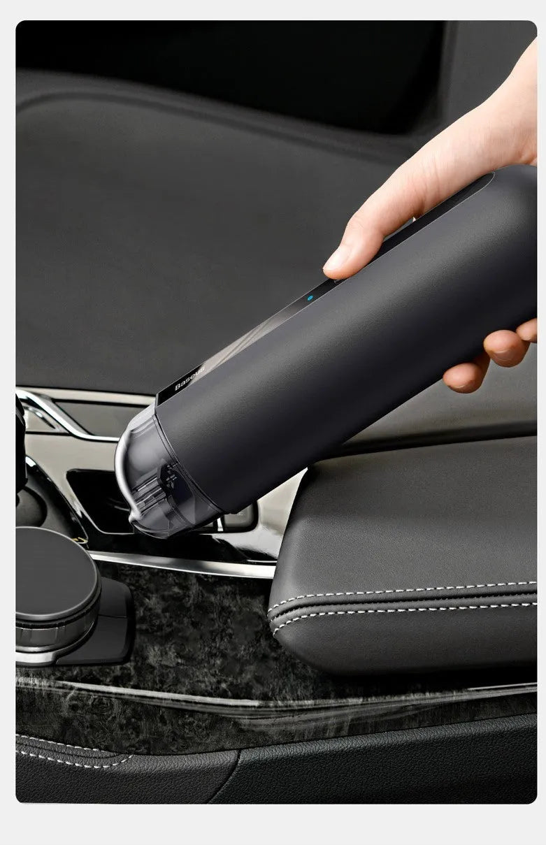 Baseus handheld cordless car vacuum cleaner in black, white, or green with blowing hose attachment.