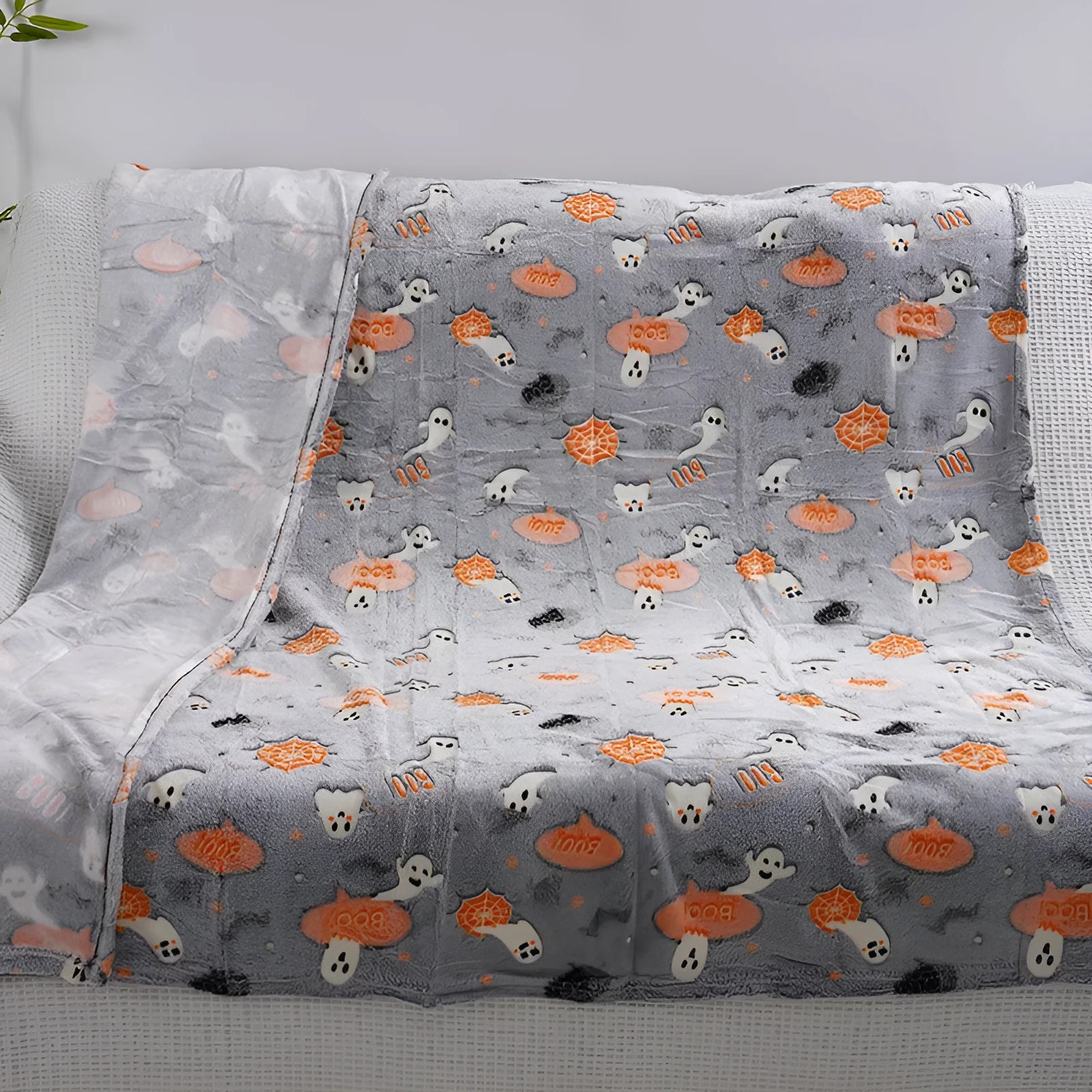 Cartoon-style flannel blanket for covering air conditioners, shown in a child's room.