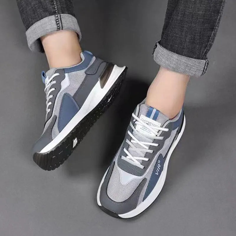 Men's colour block mesh lace-up running shoes in black, grey and white on a white background.