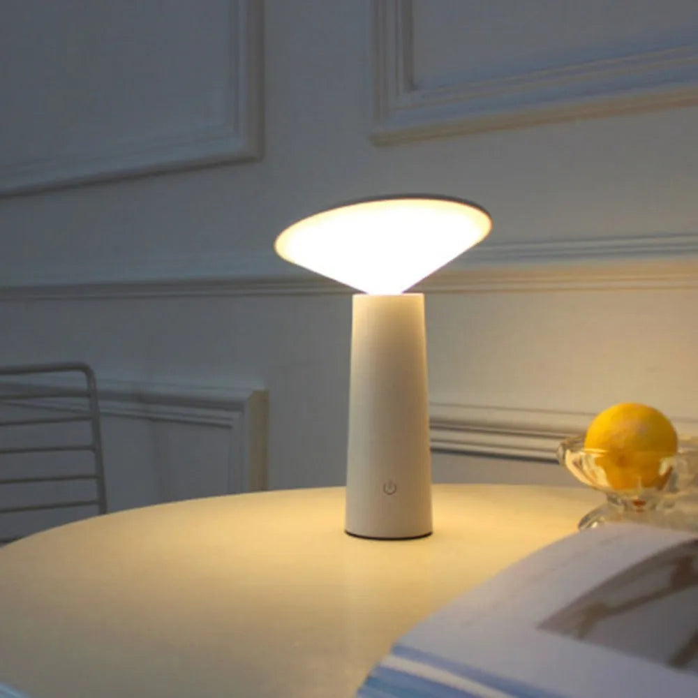 Black USB rechargeable LED table lamp with touch sensor and adjustable flip head on wooden desk