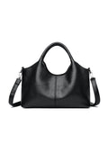 Women's soft genuine leather cross-body bag in beige colour, showing large capacity interior.