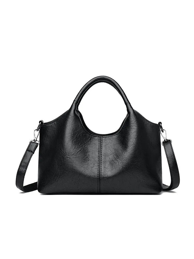 Women's soft genuine leather cross-body bag in beige colour, showing large capacity interior.