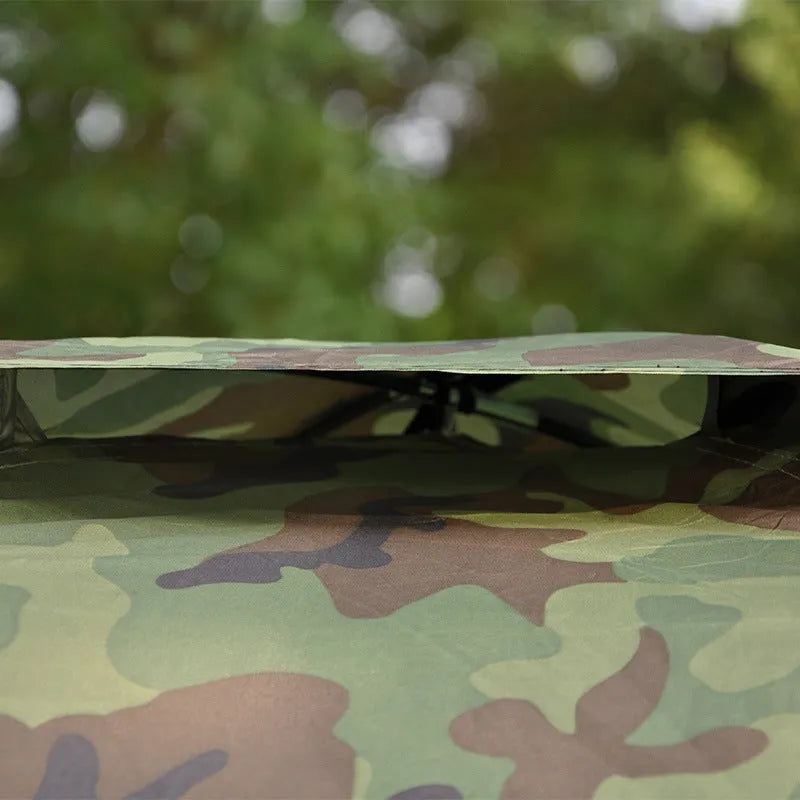Green camouflage two-person camping tent with mesh windows and triangular skylight.