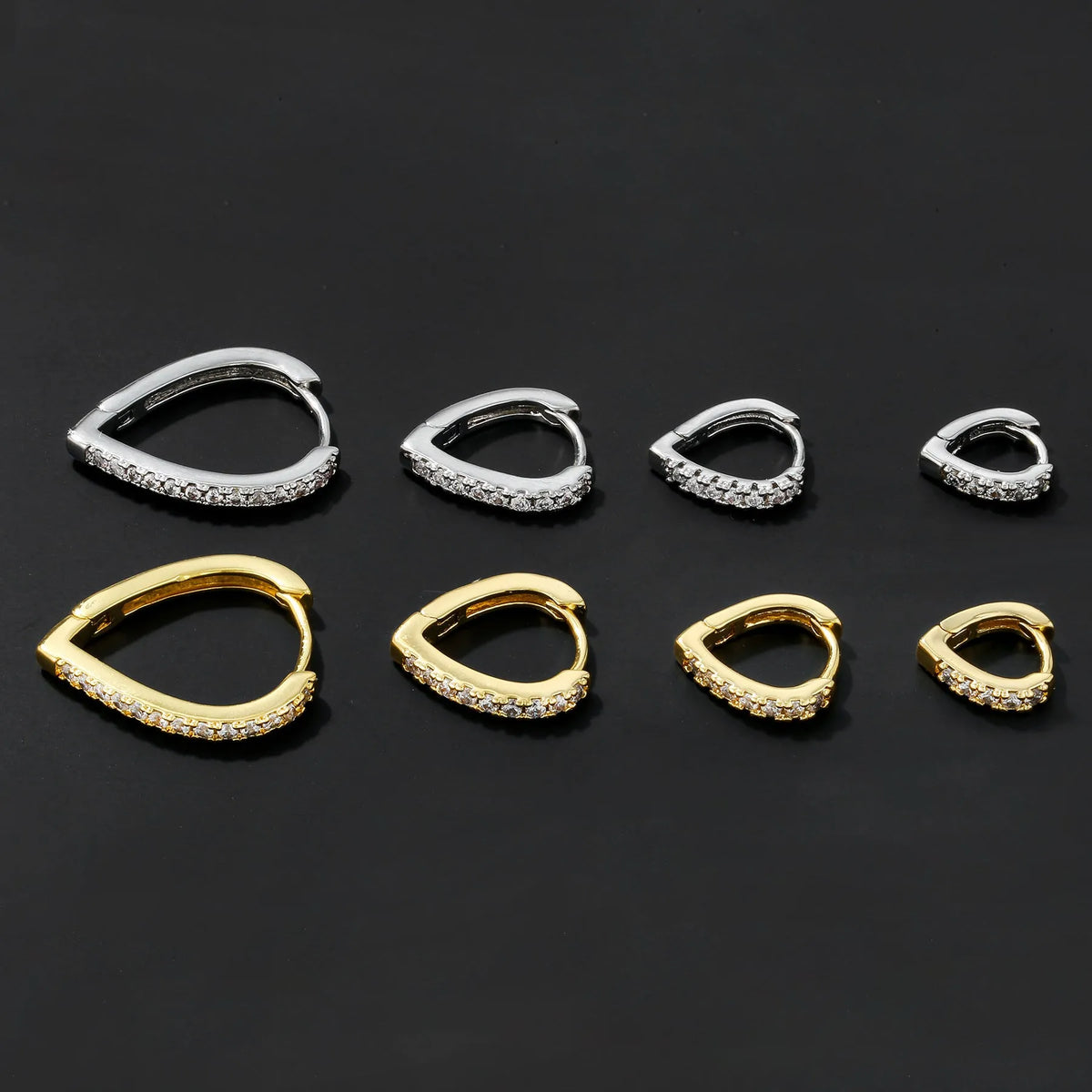 Copper ear clip with geometrical heart design in gold or white electroplated finish