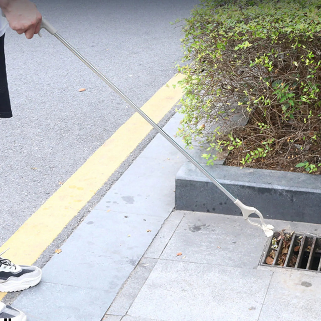 Stainless steel reacher grabber tool with push handle and non-slip chuck, 40cm long.