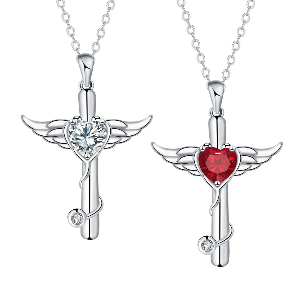 Close-up of a cross and angel wings charm on an adjustable stethoscope chain necklace.