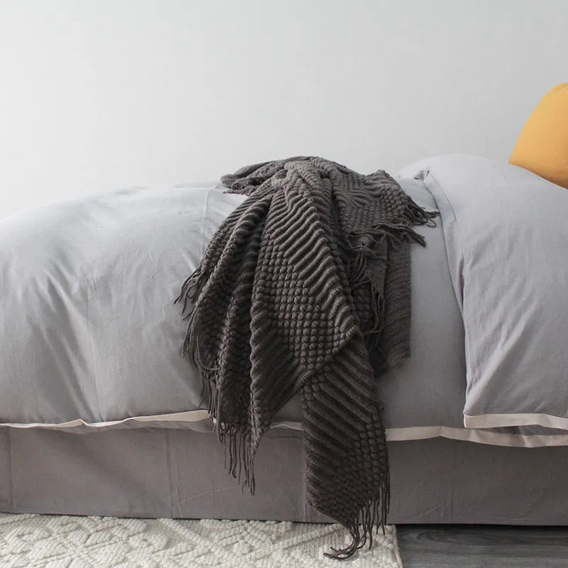 Small rectangular polyester nap blanket in dark grey, khaki, or light grey, shown flat with dimensions 127cm by 170cm.