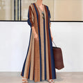 Camel coloured women's vertical striped V-neck long sleeve A-line knitted dress on a hanger.