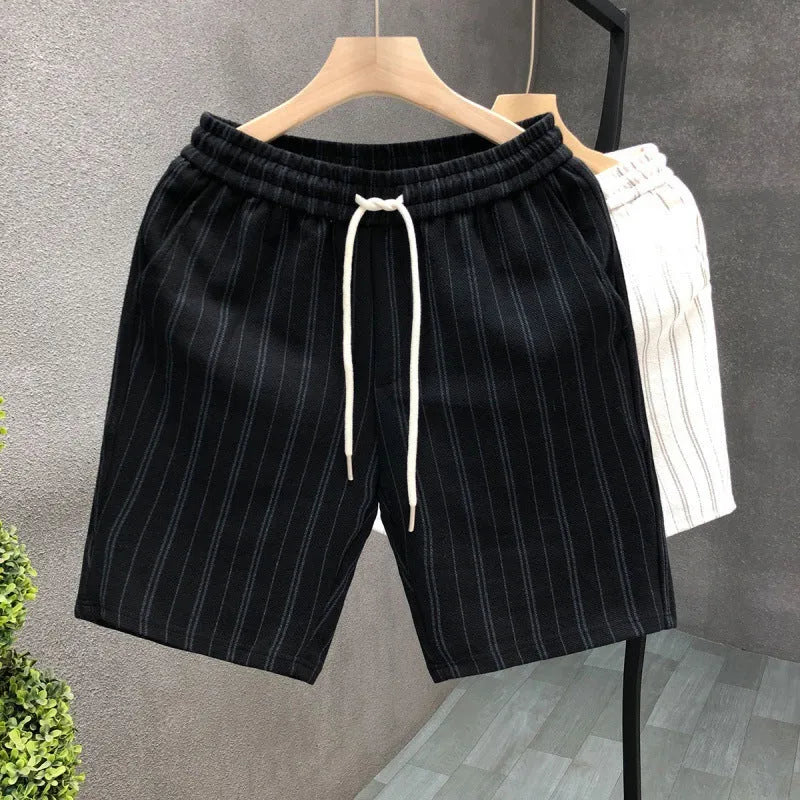 Men's black and white striped fleece-lined casual shorts with an ankle band and double waistband.