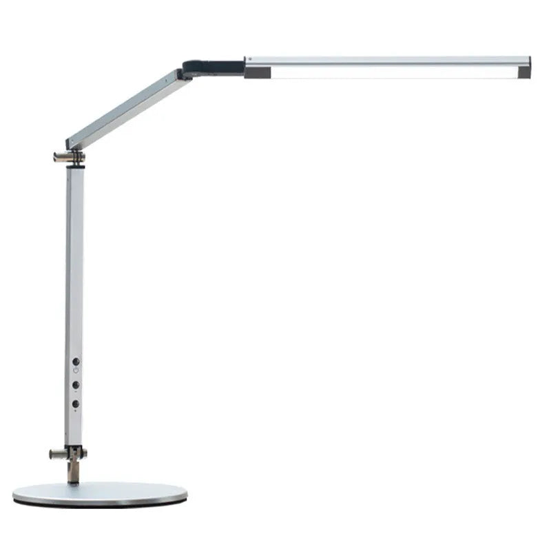 Black folding clip-on LED desk lamp with remote control on a wooden desk.
