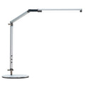 Black folding clip-on LED desk lamp with remote control on a wooden desk.