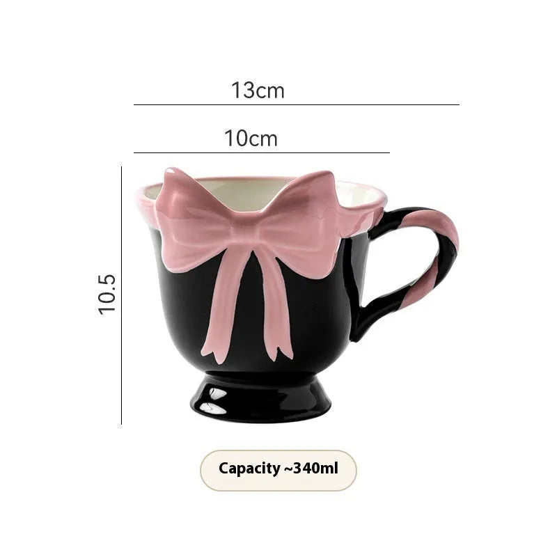 Ceramic mug with heart and bow design in black pink or white powder colour, 301-400ml capacity